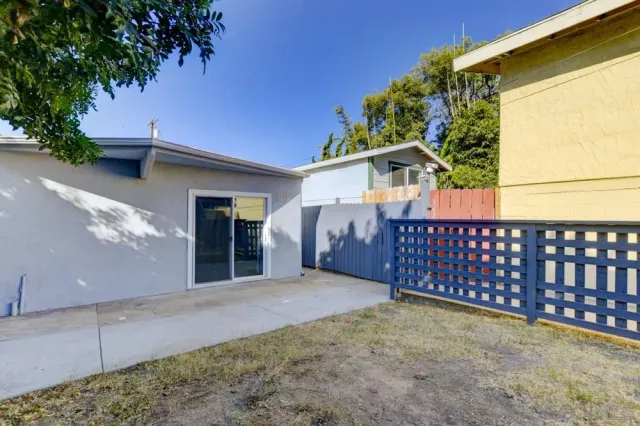 a view of a door and brick wall