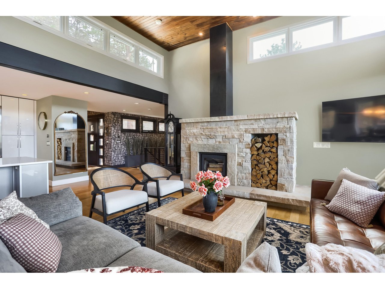 153 Poorman Road Boulder, CO 80302 - Photo 24 of 50 Comfortable living room with wood-burning fireplace centerpiece