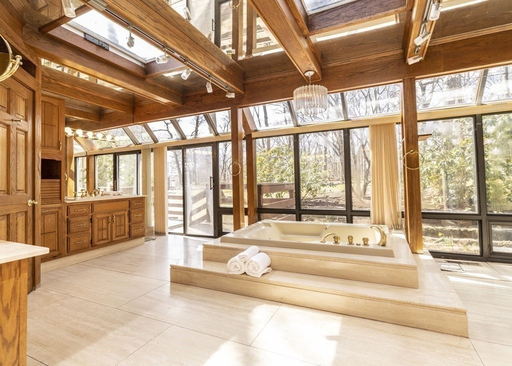 6 Nelson Drive Brookline, MA 02467 - Photo 17 of 42 a spacious bedroom with a bed and a large window