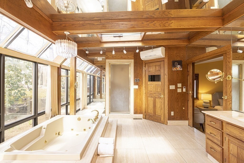 6 Nelson Drive Brookline, MA 02467 - Photo 18 of 42 a spacious bathroom with a tub and a large mirror