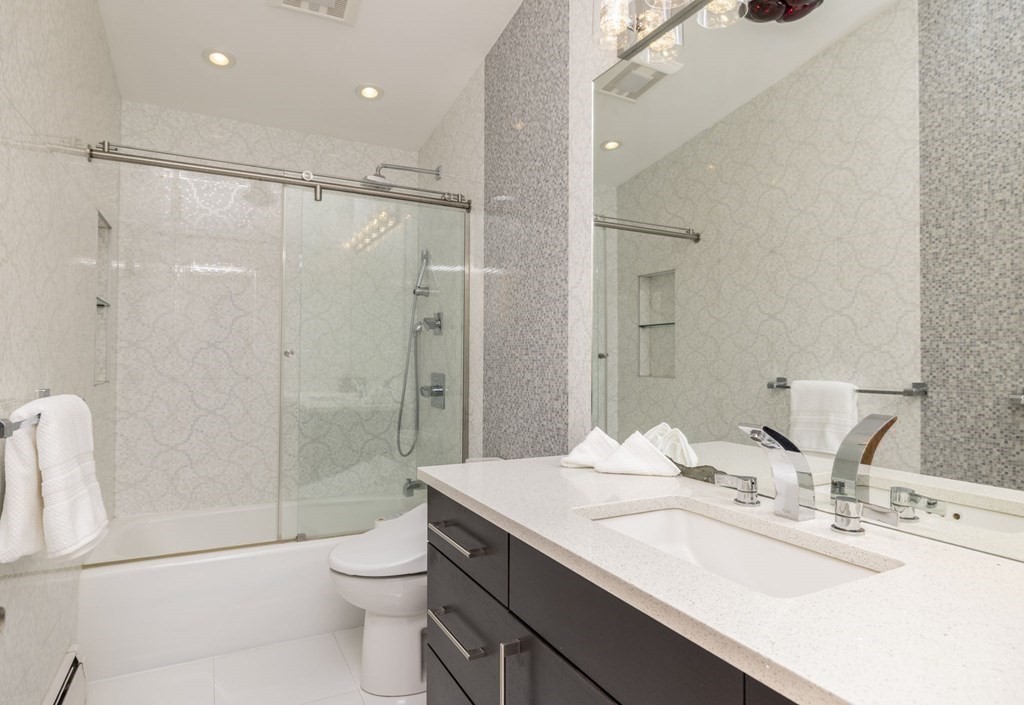 6 Nelson Drive Brookline, MA 02467 - Photo 22 of 42 a bathroom with a granite countertop sink toilet and shower