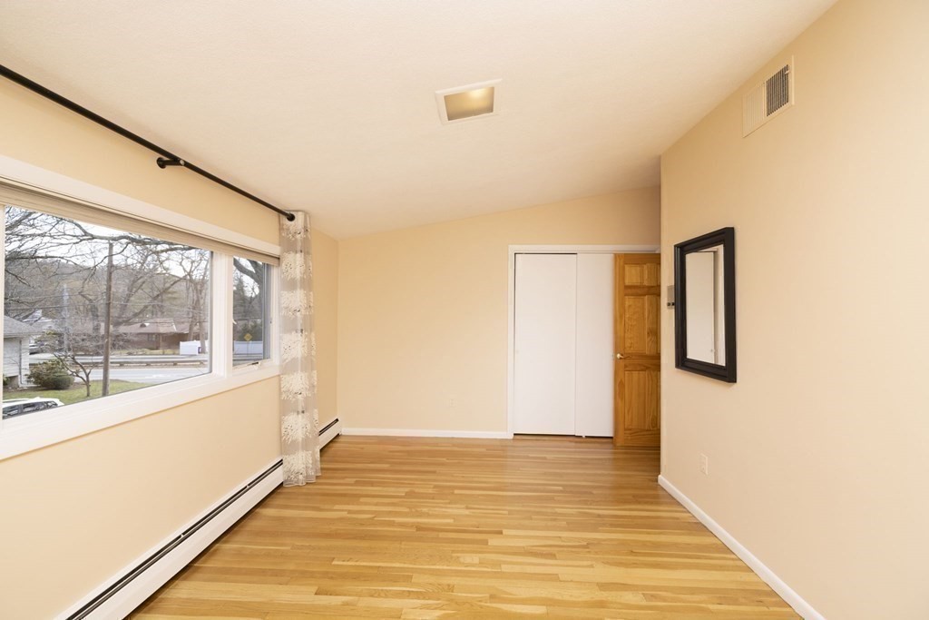 6 Nelson Drive Brookline, MA 02467 - Photo 24 of 42 a view of an empty room with a window
