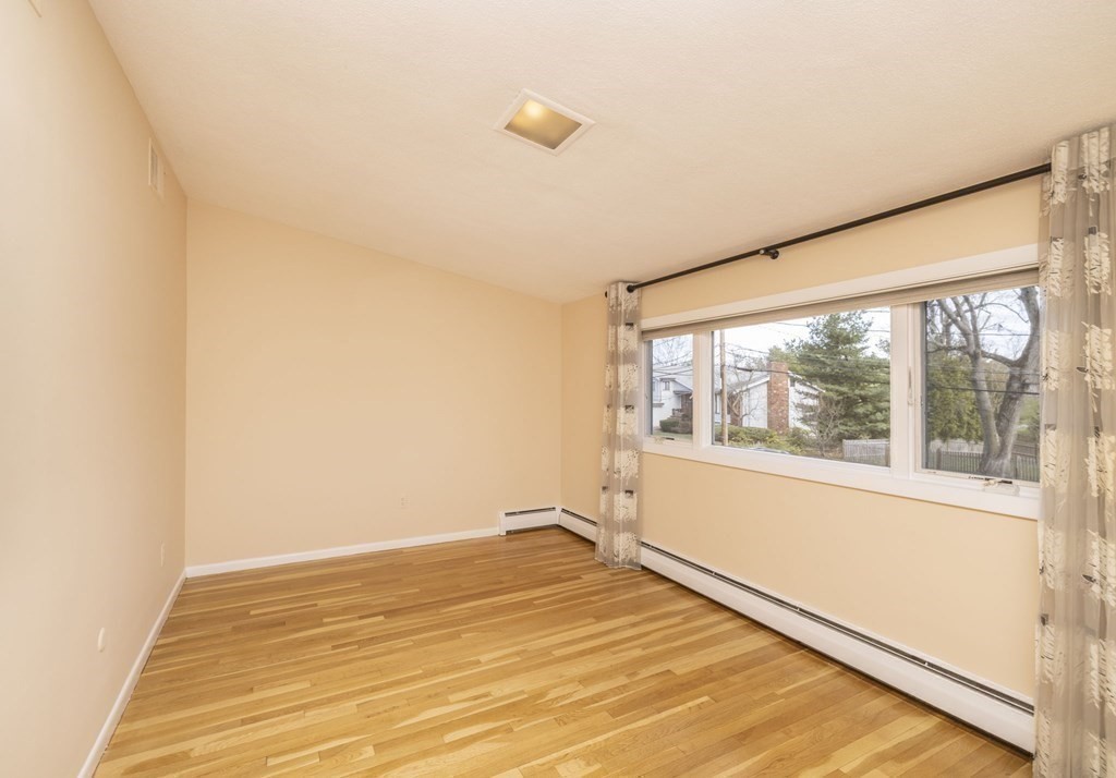 6 Nelson Drive Brookline, MA 02467 - Photo 25 of 42 a view of an empty room with a window