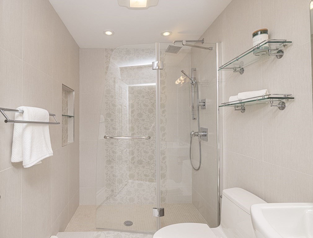 6 Nelson Drive Brookline, MA 02467 - Photo 30 of 42 a bathroom with a shower and a toilet