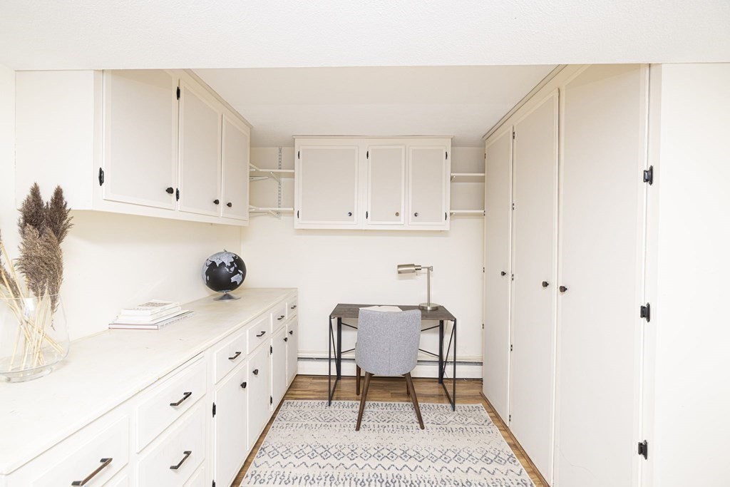 6 Nelson Drive Brookline, MA 02467 - Photo 33 of 42 a kitchen with granite countertop white cabinets and white appliances
