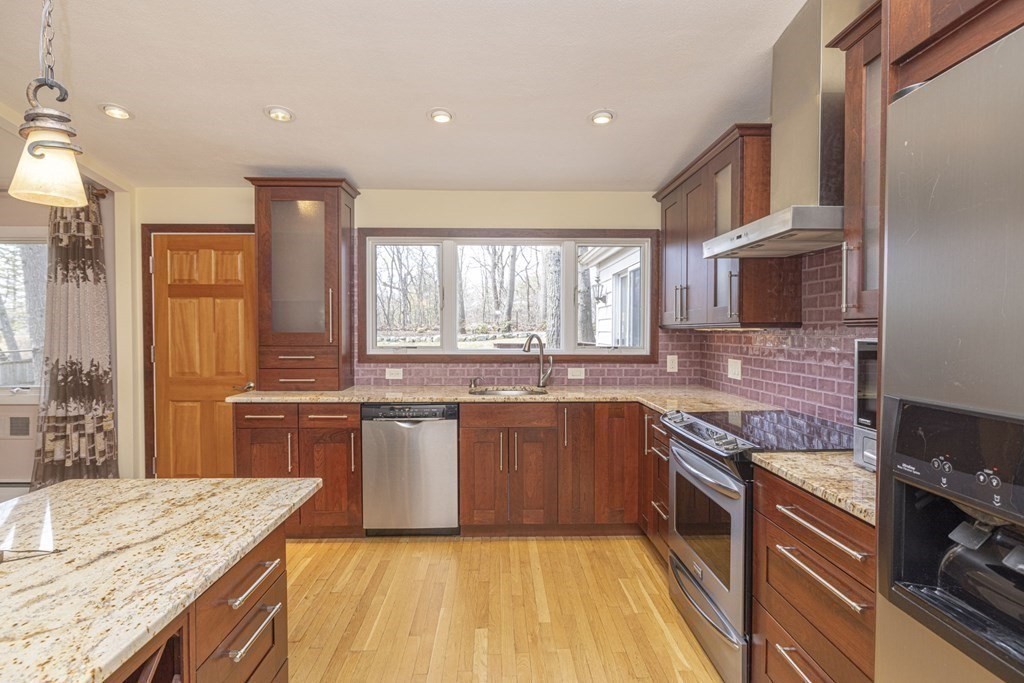 6 Nelson Drive Brookline, MA 02467 - Photo 7 of 42 a large kitchen with granite countertop lots of counter top space and sink