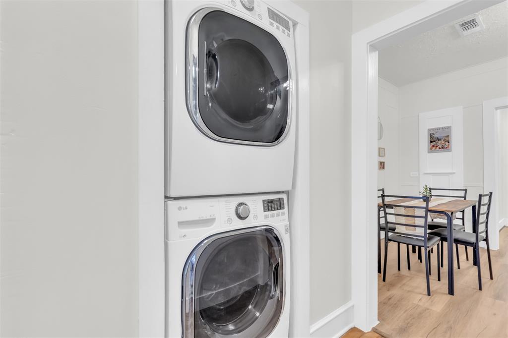 4121 Junius Street, Unit 4123 Dallas, TX 75246 - Photo 23 of 23 a view of a hallway with washer and dryer