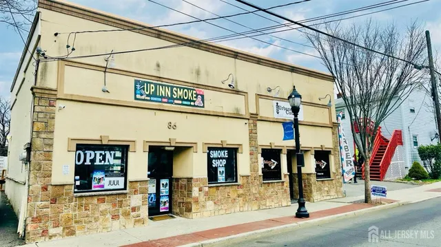 a view of a street with stores