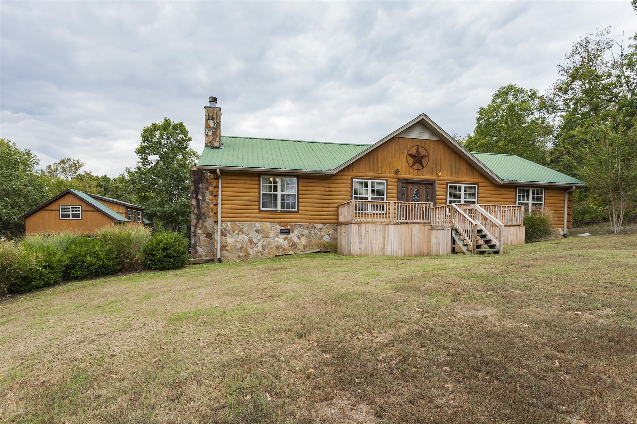 1782 Chicken Road Lebanon, TN 37090 - Photo 22 of 24 a front view of a house with a garden and trees