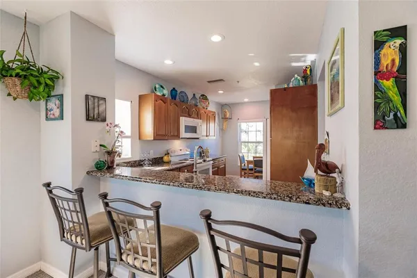 a kitchen with a table and chairs in it