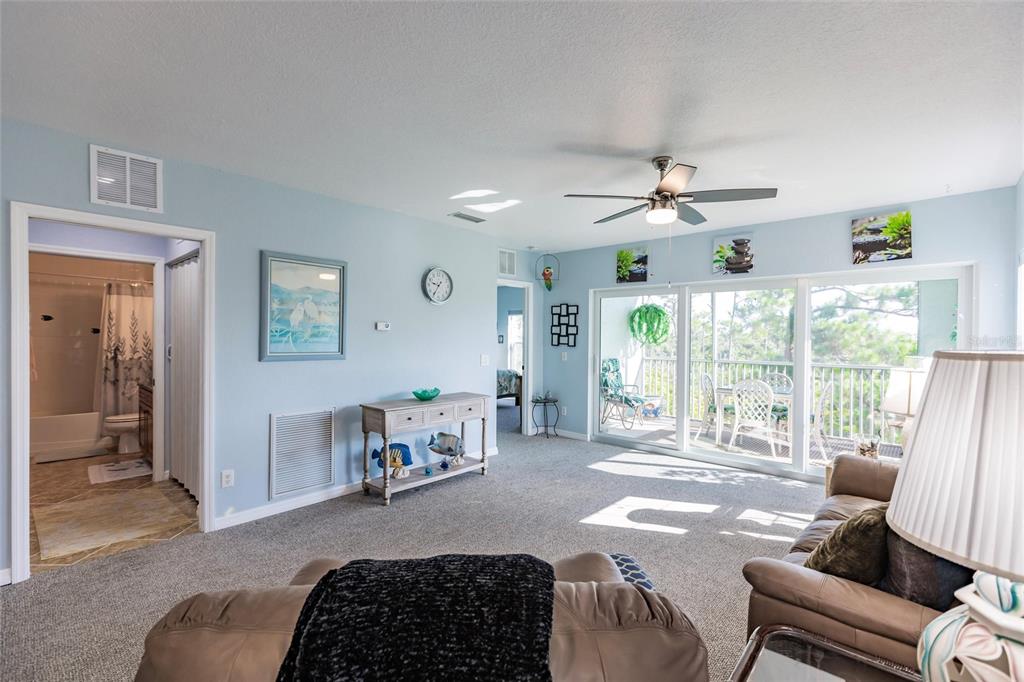 8409 Placida Road, Unit 308 Placida, FL 33946 - Photo 18 of 56 a living room with furniture and a large window