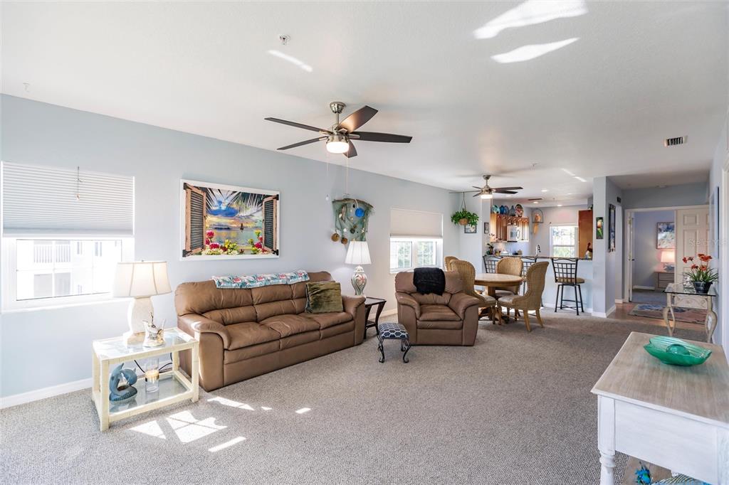 8409 Placida Road, Unit 308 Placida, FL 33946 - Photo 19 of 56 a living room with furniture a couch and a window