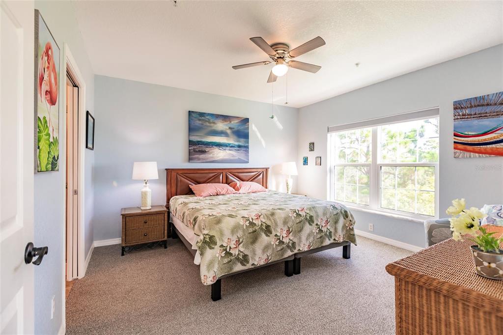 8409 Placida Road, Unit 308 Placida, FL 33946 - Photo 20 of 56 a bedroom with a bed and a window