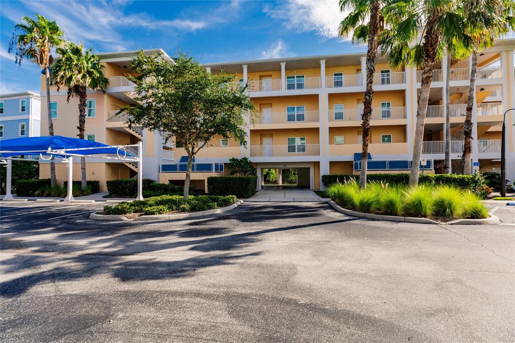 8409 Placida Road, Unit 308 Placida, FL 33946 - Photo 3 of 56 front view of a building with a yard