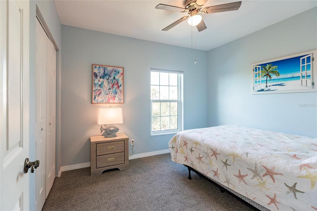 8409 Placida Road, Unit 308 Placida, FL 33946 - Photo 31 of 56 a bedroom with a bed and a window