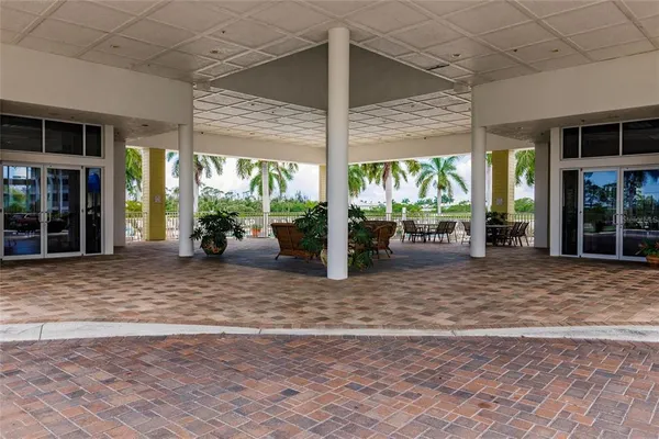 a living room with lots of furniture and a large window