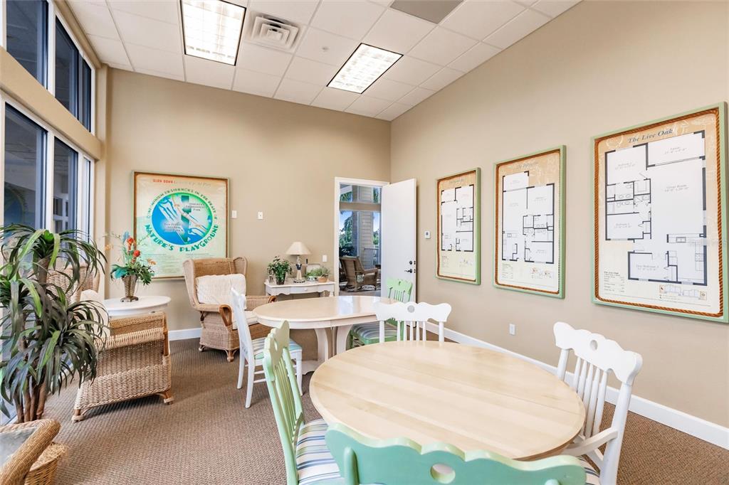 8409 Placida Road, Unit 308 Placida, FL 33946 - Photo 50 of 56 a view of a dining room with furniture a livingroom and chandelier