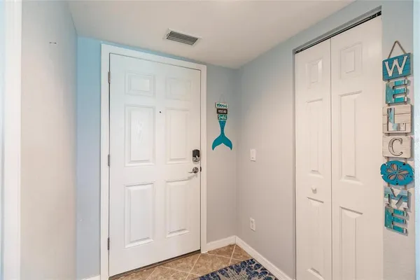 a view of an entryway with wooden floor