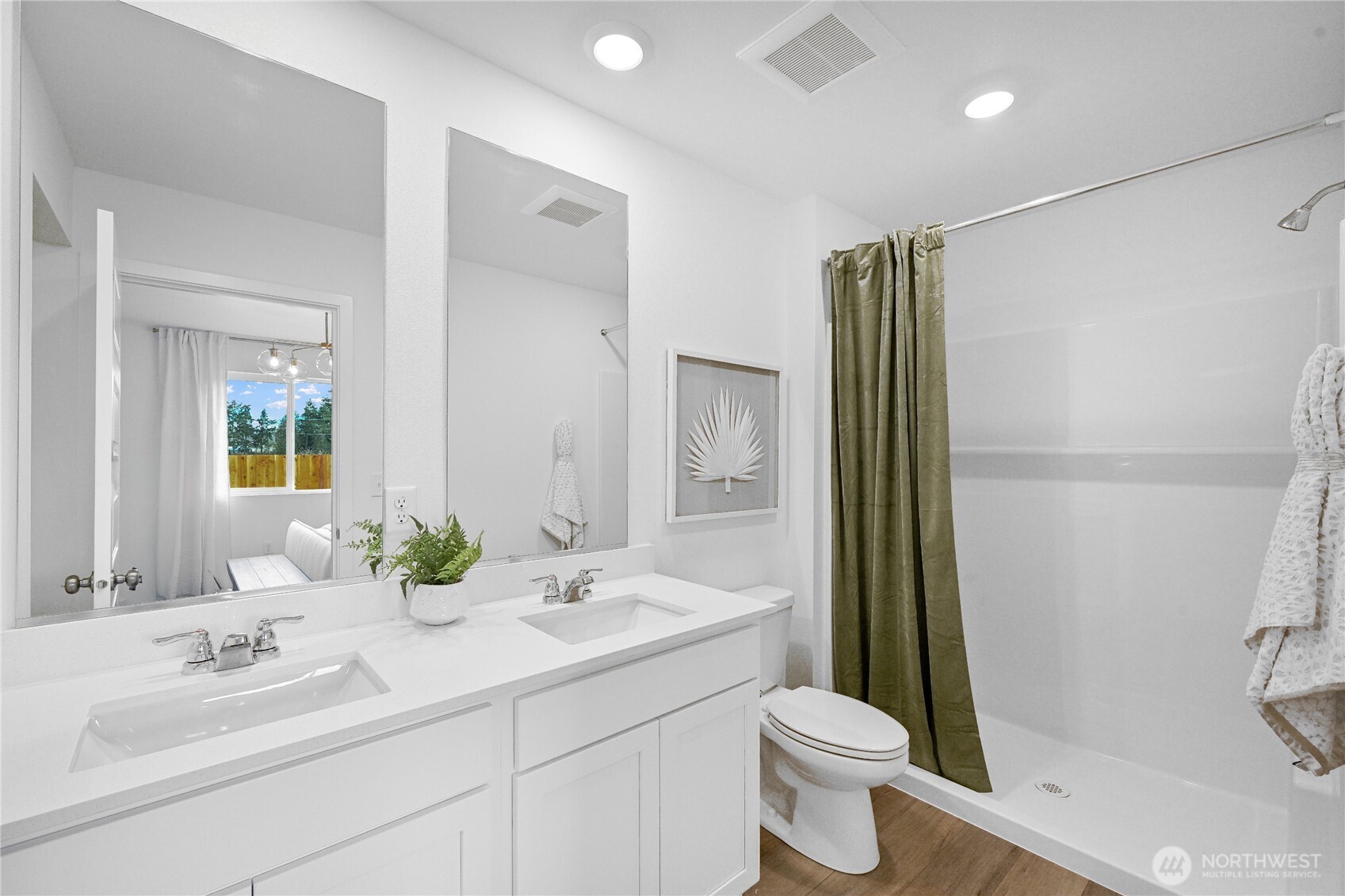 55 Moonshadow Lane Sequim, WA 98382 - Photo 15 of 22 a bathroom with a double vanity sink toilet and shower