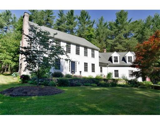 119 Robinson Road Boxborough, MA 01719 - Photo 1 of 27 a front view of a house with a garden