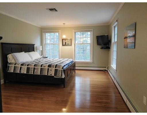 119 Robinson Road Boxborough, MA 01719 - Photo 20 of 27 a bedroom with a bed and wooden floor