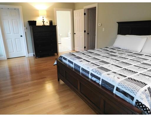 119 Robinson Road Boxborough, MA 01719 - Photo 21 of 27 a bedroom with a bed and wooden floor