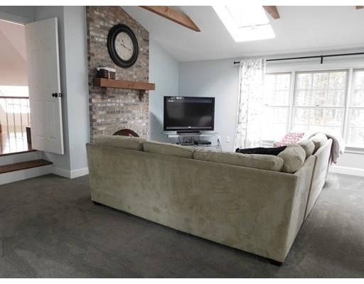 119 Robinson Road Boxborough, MA 01719 - Photo 23 of 27 a living room with furniture and a flat screen tv