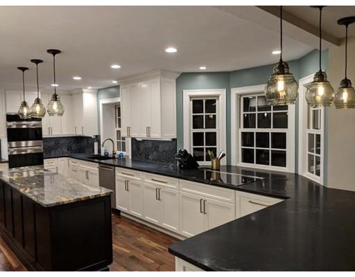 119 Robinson Road Boxborough, MA 01719 - Photo 3 of 27 a kitchen with stainless steel appliances granite countertop a sink a stove and a wooden cabinets