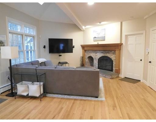 119 Robinson Road Boxborough, MA 01719 - Photo 7 of 27 a living room with furniture and a flat screen tv