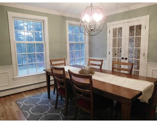 119 Robinson Road Boxborough, MA 01719 - Photo 10 of 27 a view of a dining room with furniture a chandelier and wooden floor
