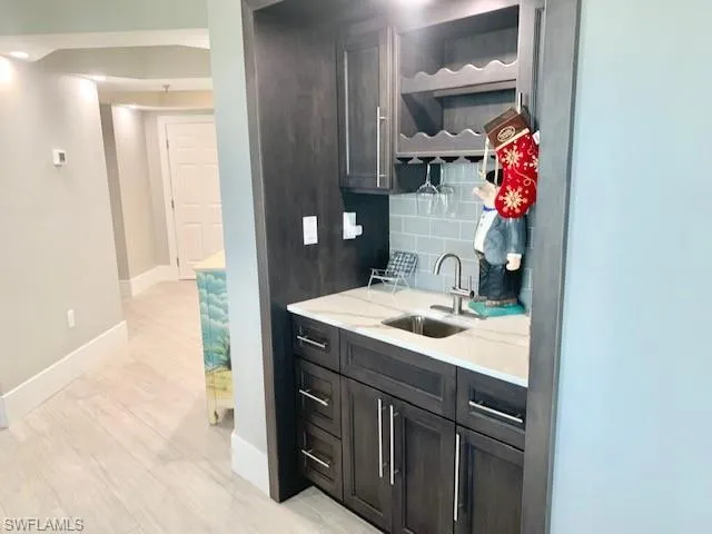 a bathroom with a sink vanity and a mirror