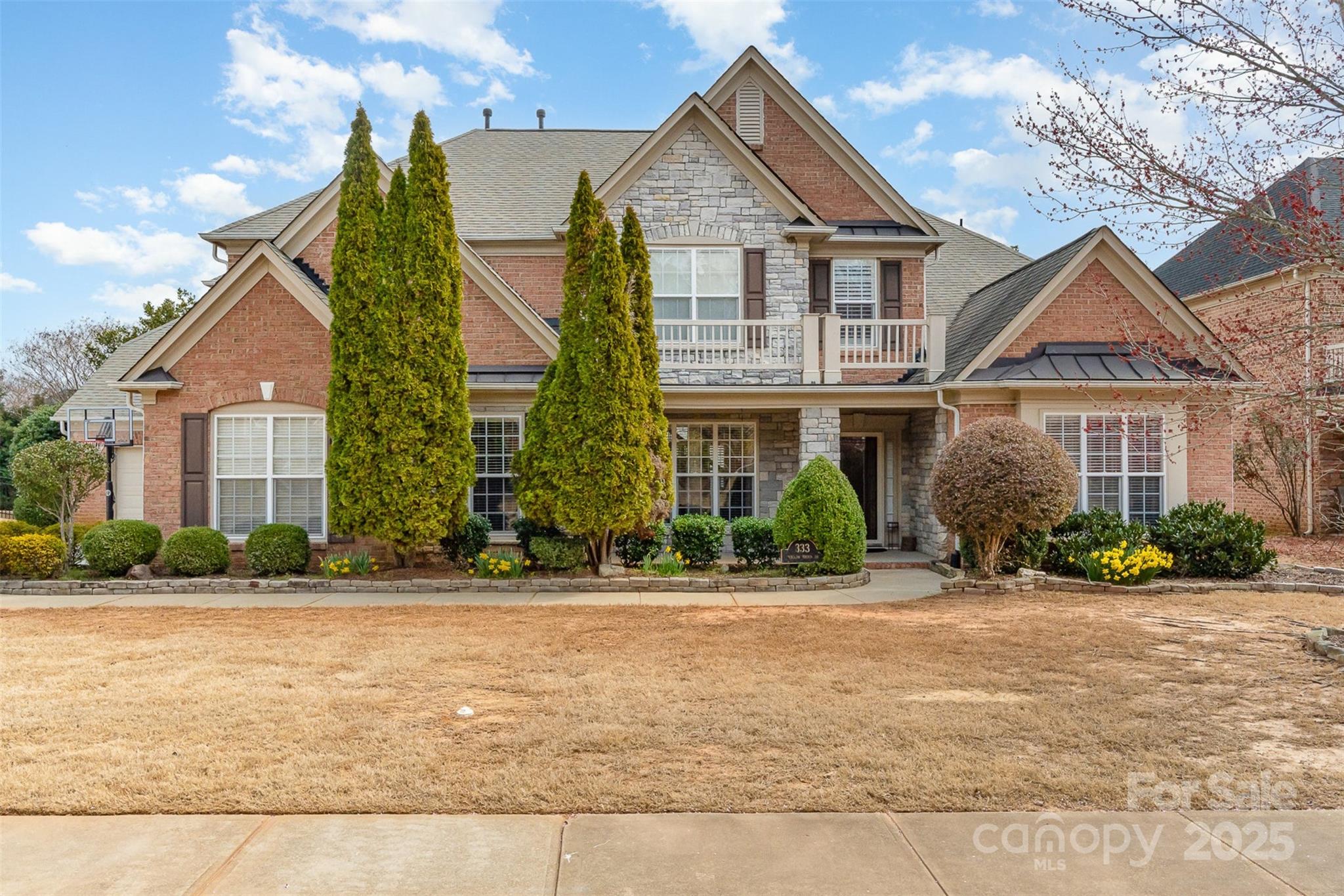 333 Willow Brook Drive Matthews, NC 28105 - Photo 1 of 4 front view of a house with a yard