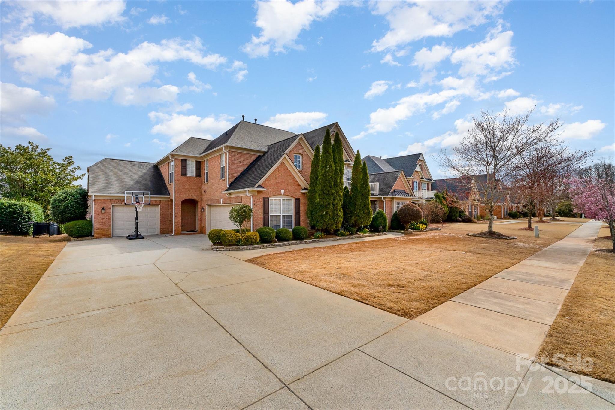 333 Willow Brook Drive Matthews, NC 28105 - Photo 2 of 4 a view of a white house with a yard