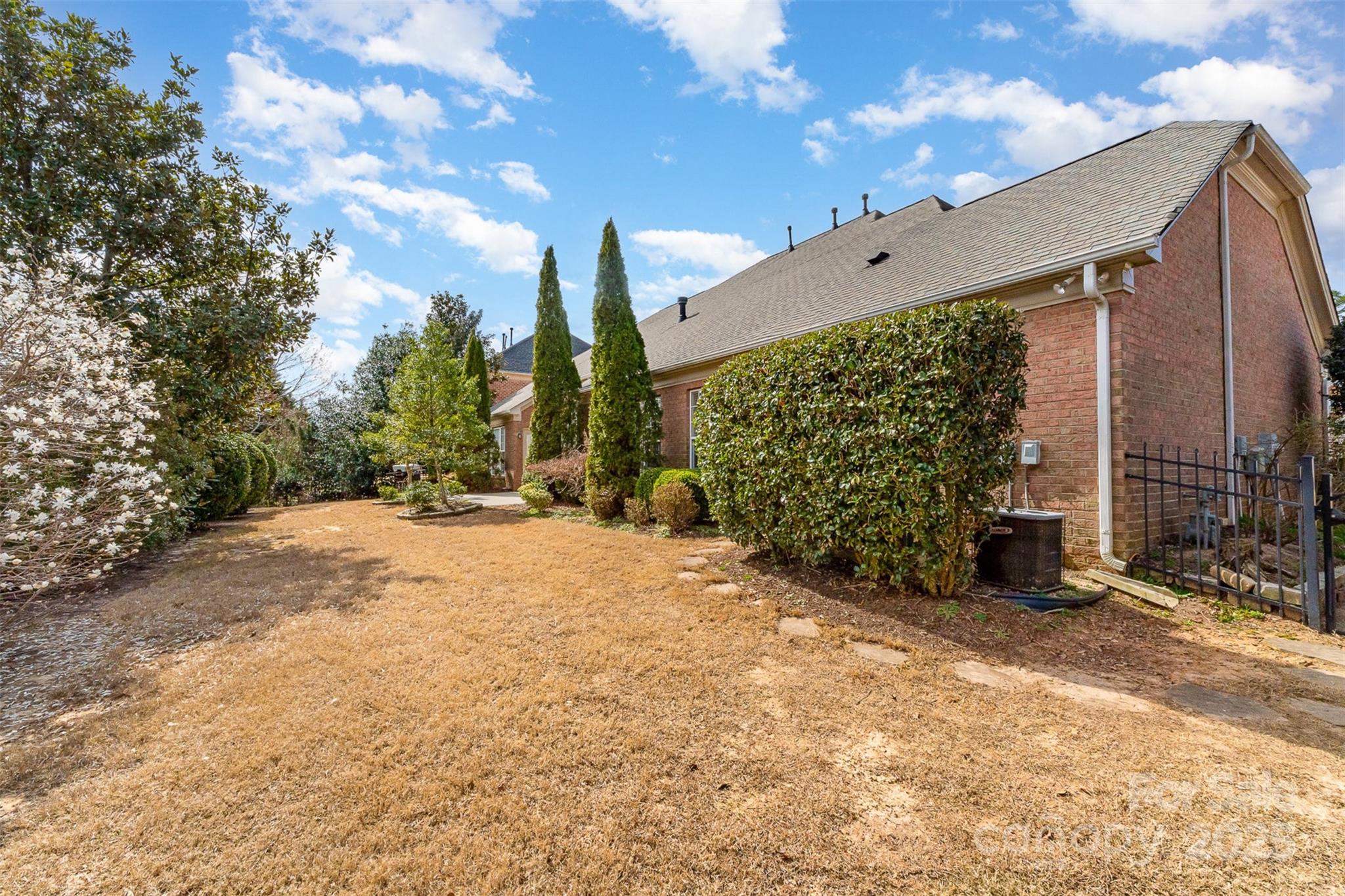333 Willow Brook Drive Matthews, NC 28105 - Photo 4 of 4 a view of a back yard with porch
