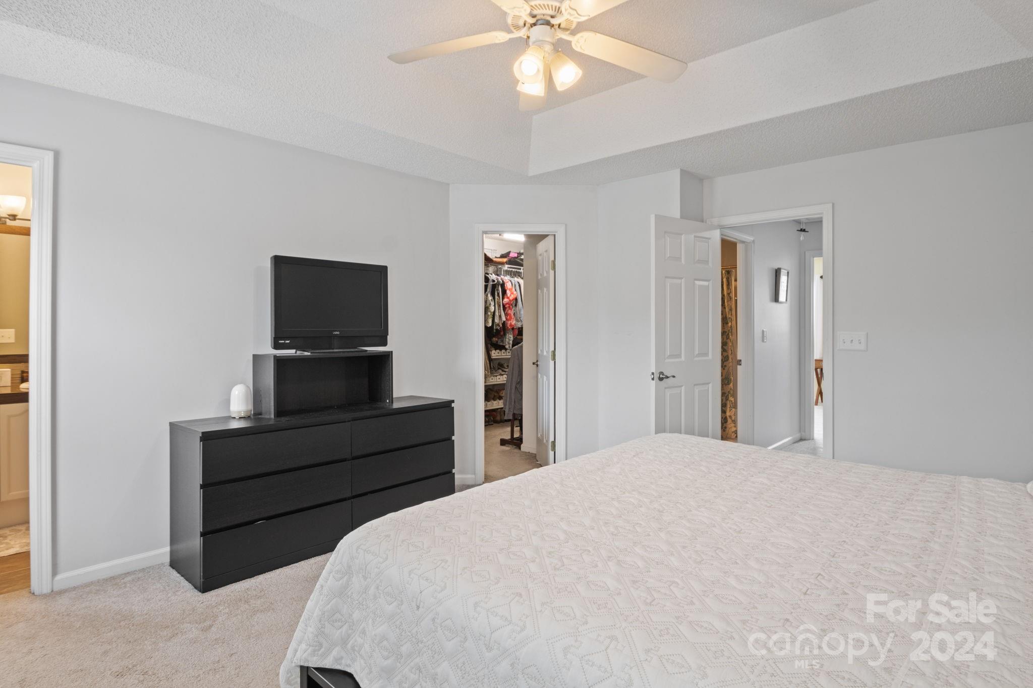 6031 Creft Circle Indian Trail, NC 28079 - Photo 16 of 28 a bedroom with a bed and a television