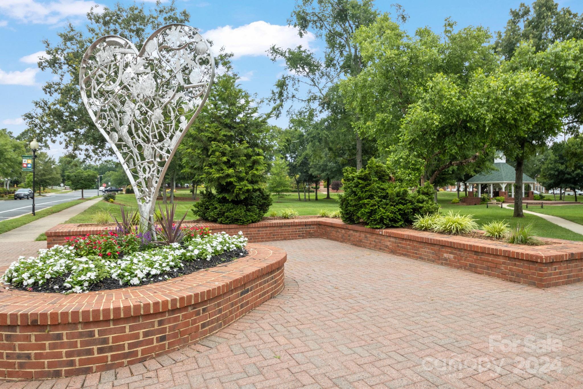 6031 Creft Circle Indian Trail, NC 28079 - Photo 21 of 28 a view of a garden with a fountain