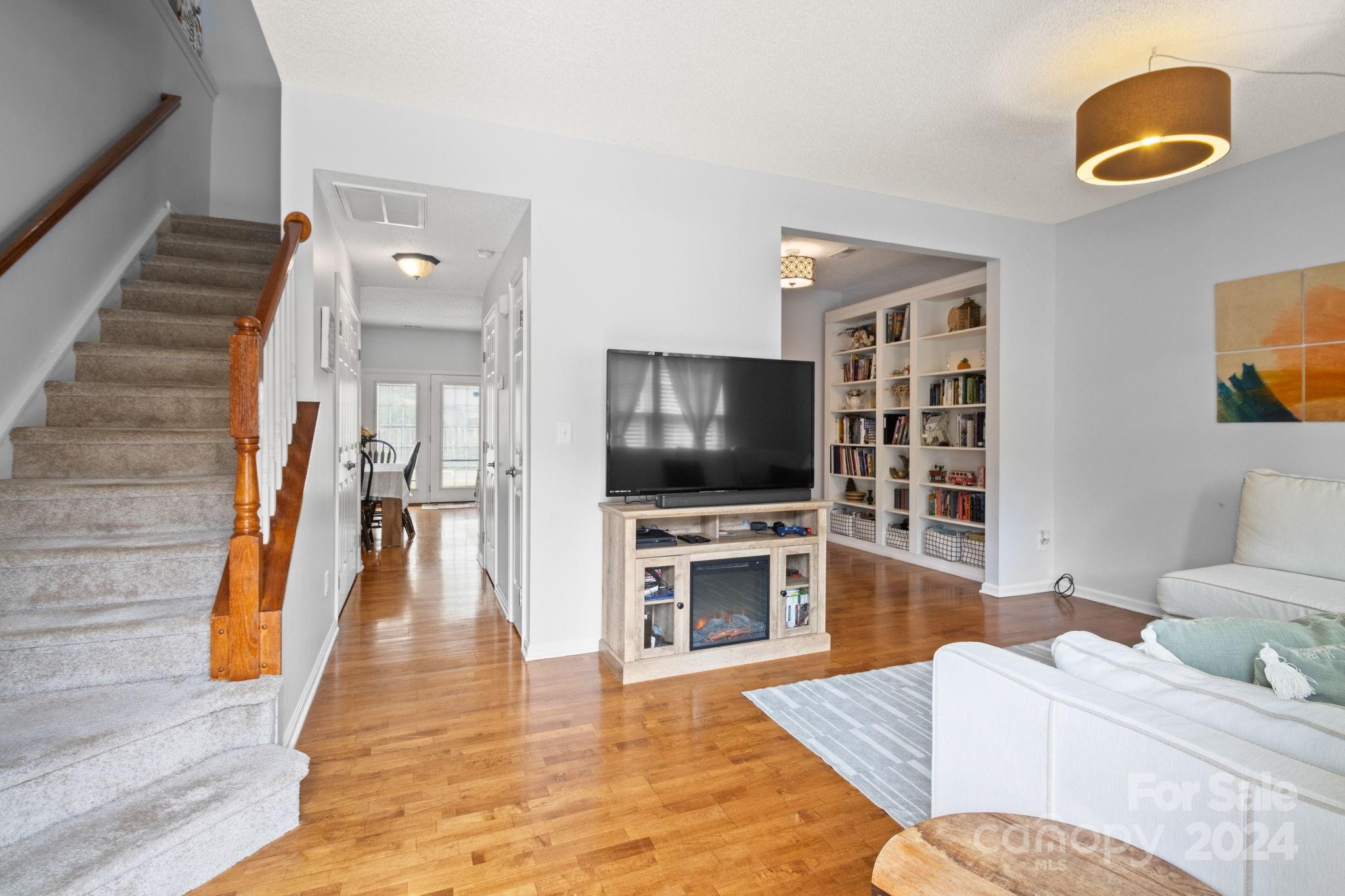 6031 Creft Circle Indian Trail, NC 28079 - Photo 3 of 28 a living room with furniture and a flat screen tv