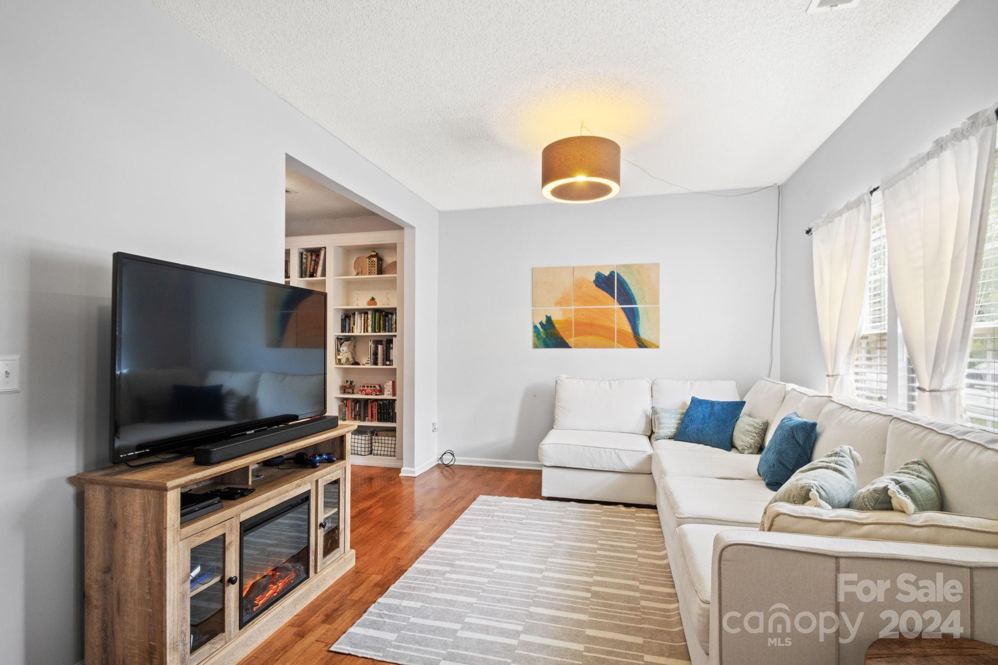 6031 Creft Circle Indian Trail, NC 28079 - Photo 4 of 28 a living room with furniture and a flat screen tv
