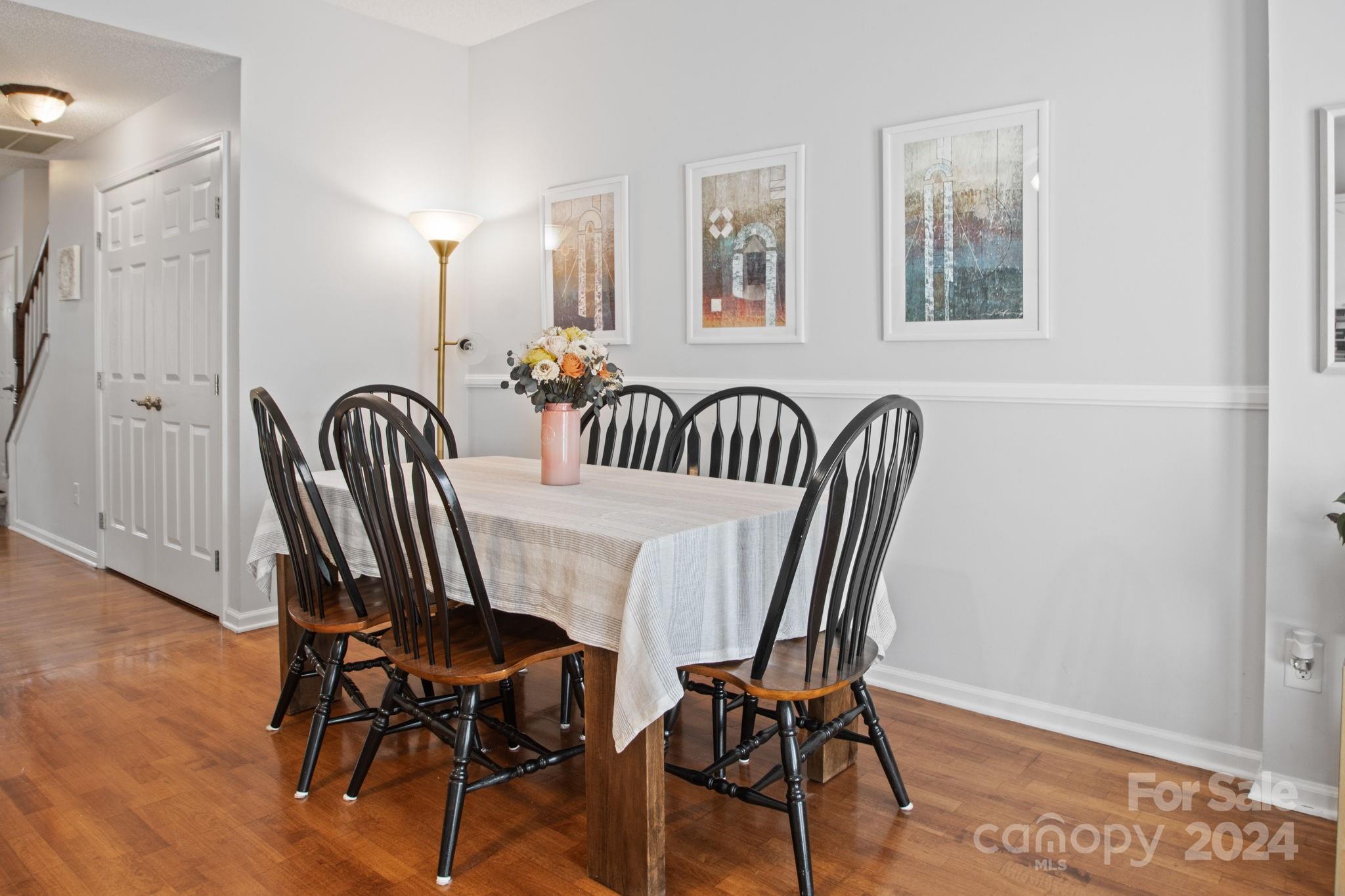 6031 Creft Circle Indian Trail, NC 28079 - Photo 9 of 28 a view of a dining room with furniture and wooden floor