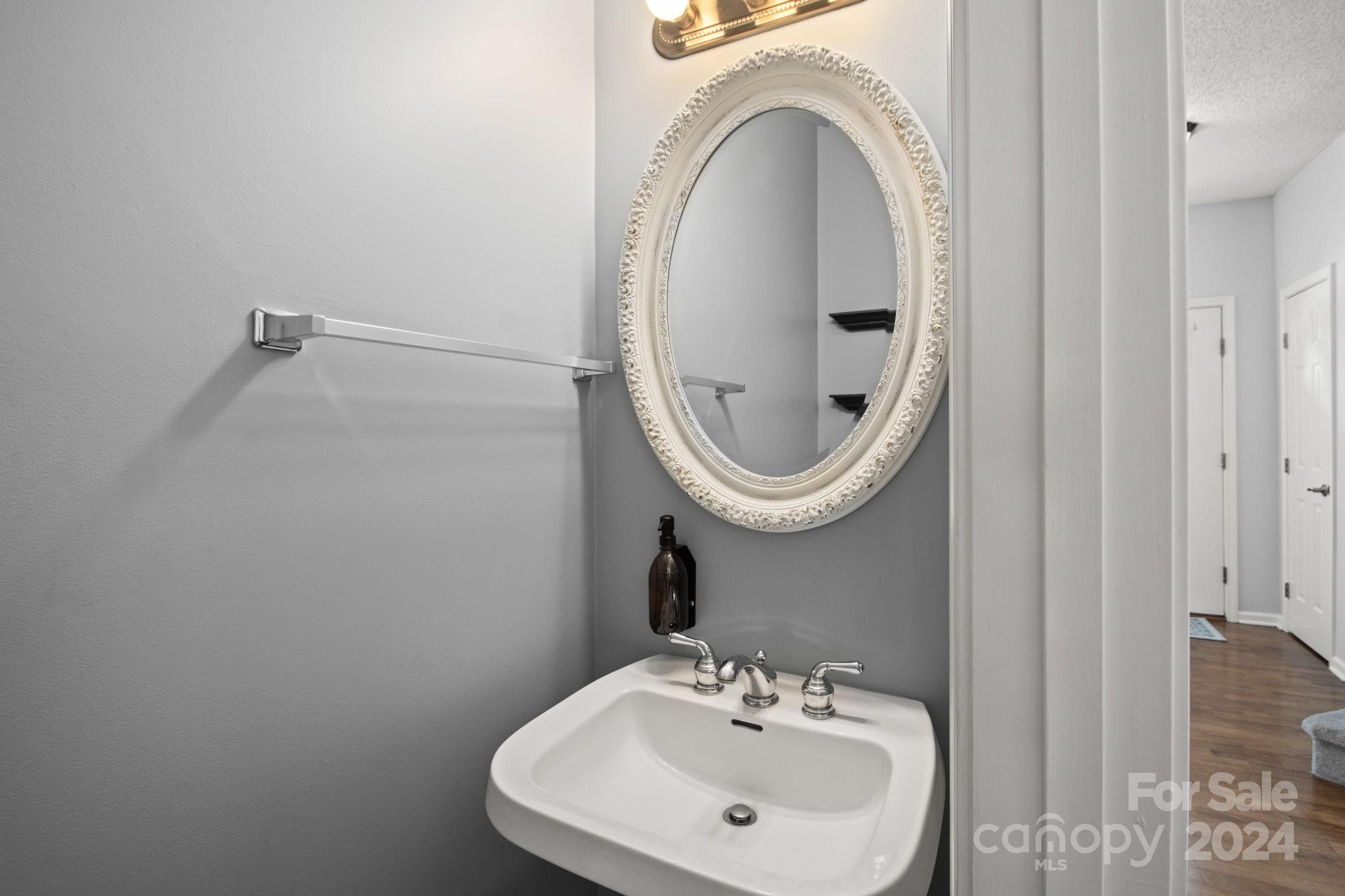 6031 Creft Circle Indian Trail, NC 28079 - Photo 10 of 28 a bathroom with a sink and a mirror