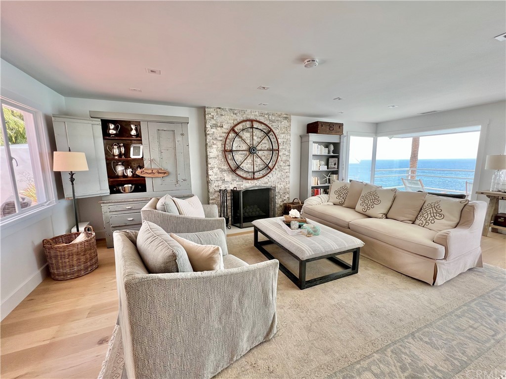 7 Camel Point Drive Laguna Beach, CA 92651 - Photo 12 of 48 a living room with furniture and a large window