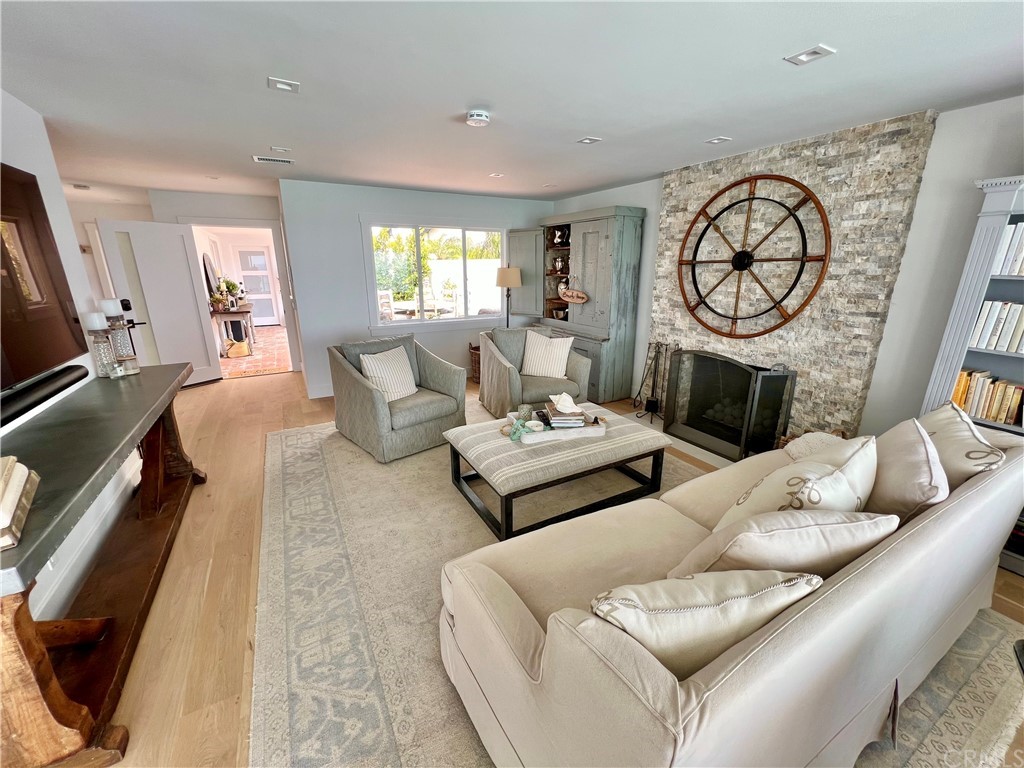 7 Camel Point Drive Laguna Beach, CA 92651 - Photo 13 of 48 a living room with furniture a large window and a fireplace