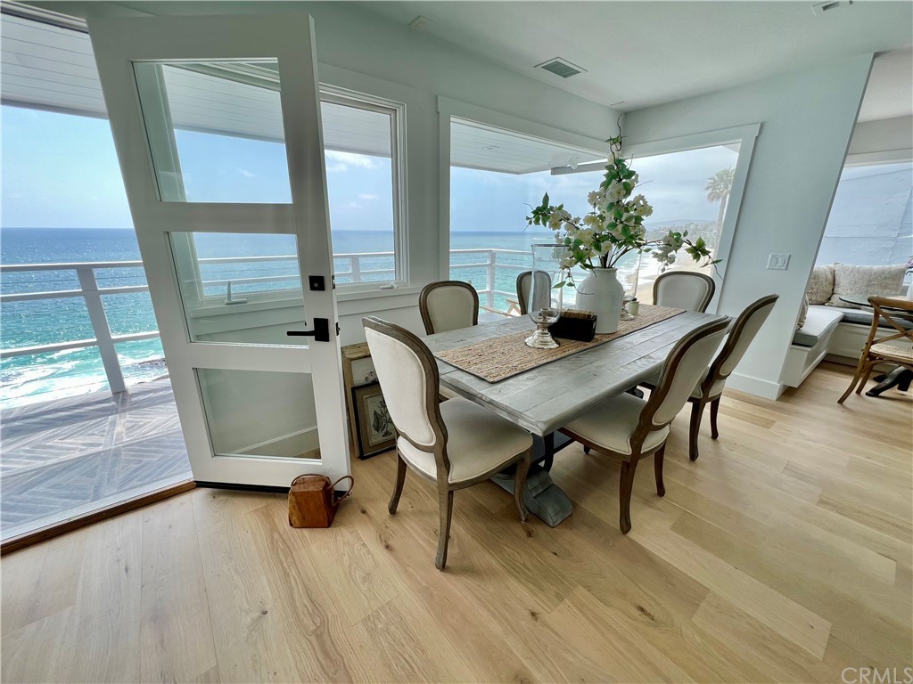 7 Camel Point Drive Laguna Beach, CA 92651 - Photo 17 of 48 a view of a dining room with furniture and wooden floor