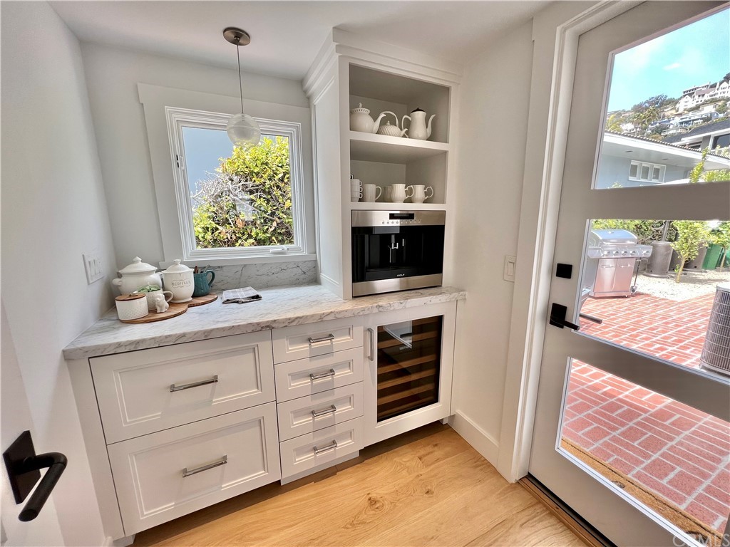 7 Camel Point Drive Laguna Beach, CA 92651 - Photo 22 of 48 a living room with furniture and a flat screen tv