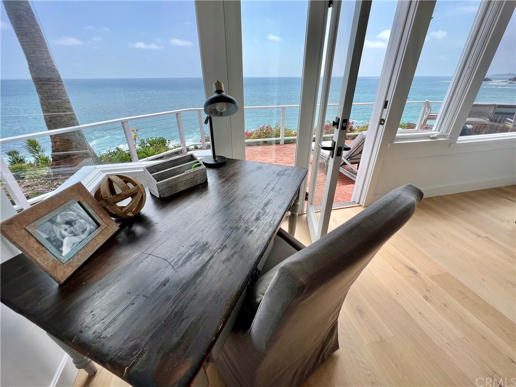 7 Camel Point Drive Laguna Beach, CA 92651 - Photo 33 of 48 a view of gym equipment and living room with windows