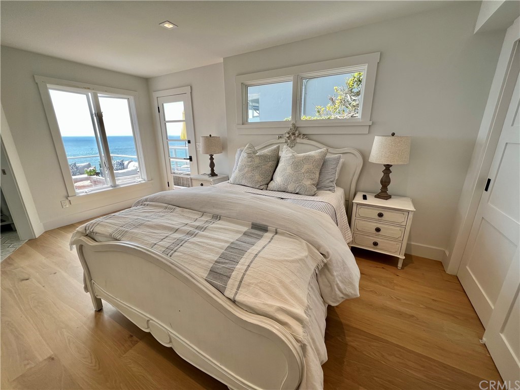 7 Camel Point Drive Laguna Beach, CA 92651 - Photo 36 of 48 a bedroom with a bed and a large window