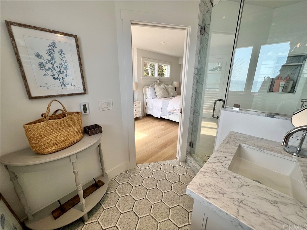 7 Camel Point Drive Laguna Beach, CA 92651 - Photo 38 of 48 a bathroom with a sink and a mirror