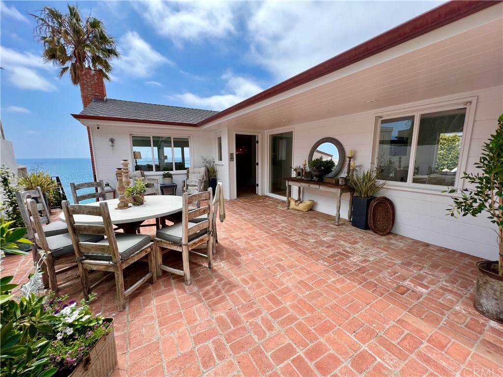 7 Camel Point Drive Laguna Beach, CA 92651 - Photo 9 of 48 a view of a porch with furniture and a potted plant