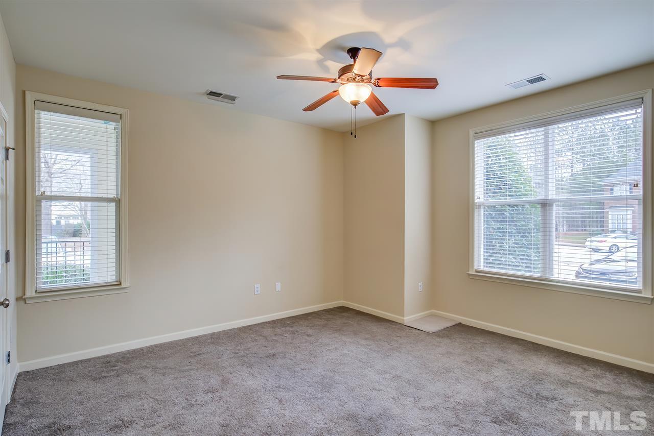 201 West Savannah Ridge Road, Unit 201 Holly Springs, NC 27540 - Photo 20 of 30 a view of an empty room with a window
