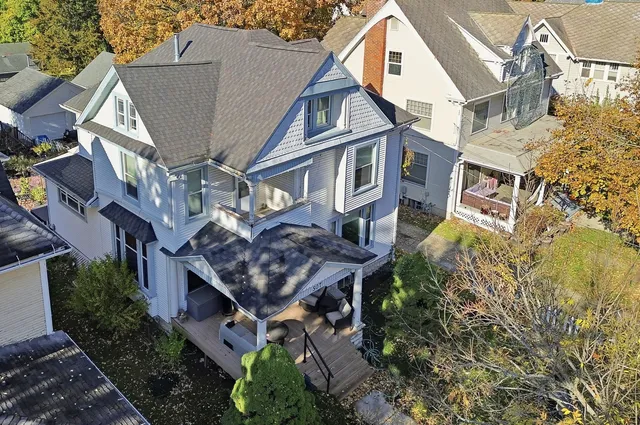a aerial view of a house with a yard